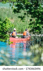 The River Stour In Suffolk Is One Of The More Picturesque Rivers To Canoe. Two Man Canoeing Rear View Though Stour River, Nayland, Suffolk, England