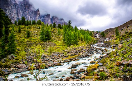 River stream in mountain in cloudy day