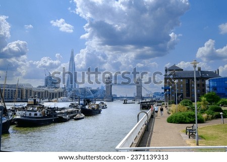 River Thames view from Waterside Gardens, Wapping, St Katharine's, London with the Tower Bridge and the Shard building in the distance.