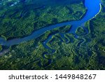 River in tropic Costa Rica, Corcovado NP. Lakes and rivers, view from airplane. Green grass in Central America. Trees with water in rainy season. Photo from air.