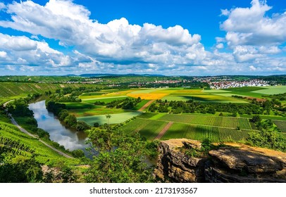 River valley with agricultural fields. Cloudy sky over summer agriculture fields. Agricultural fields in summer. Agricultural field landscape - Shutterstock ID 2173193567