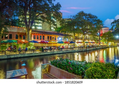River walk in San Antonio city downtown skyline cityscape of Texas USA at sunset - Shutterstock ID 1851820609