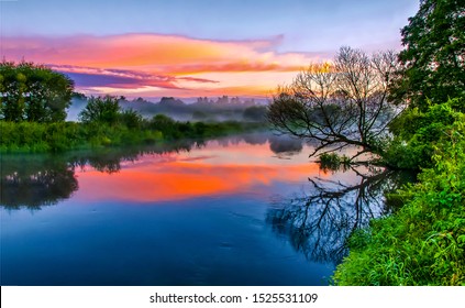 River Water In Beautiful Sunset Fog Landscape View