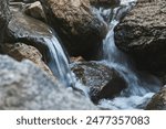 river water flow between stones       