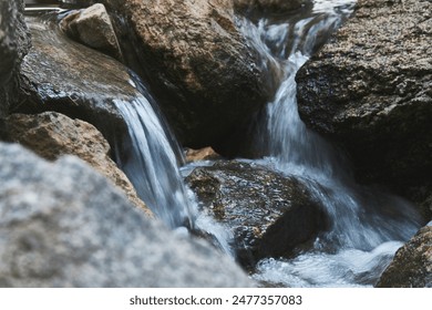 river water flow between stones        - Powered by Shutterstock