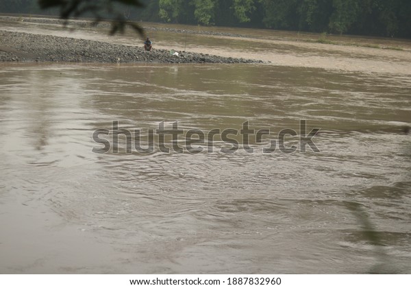 River water overflows due to\
rain