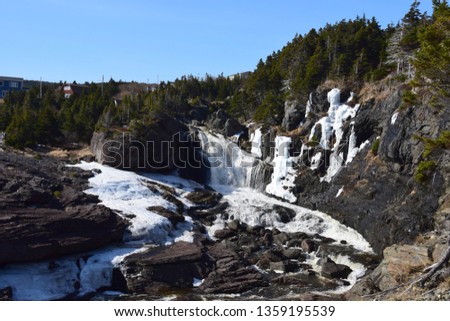  river and waterfall landscape along he East Coast trail, Stiles Cove Path near Flatrock Newfoundland Canada;  early Spring 