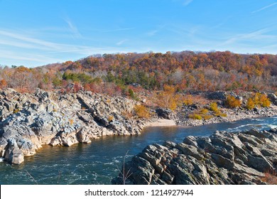 Riverbanks Of Treacherous Potomac River And Autumn Forest Nearby. Great Falls State Park Landscape With Rocky Terrain, Forests And The River.