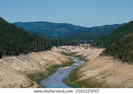 riverbed with little water due to drought caused by climate change, Spain