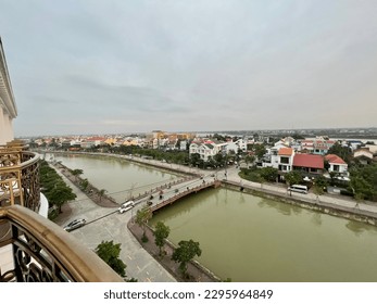 Riverfront view of a small bridge intersection in an Asian village and tourism town
