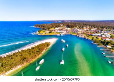 Rivermouth of CUrambene creek around Callala beach in front of Huskisson village on Jervis Bay of Australian Pacific coast - aerial view.