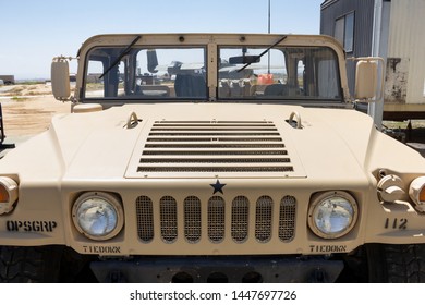 Riverside, California/United States - 06/05/2019: Looking At The Front Side Of A Humvee On A Military Base, With Aircraft In The Background