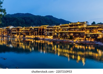 Riverside houses in Fenghuang Ancient Town, Hunan province, China - Shutterstock ID 2207210953