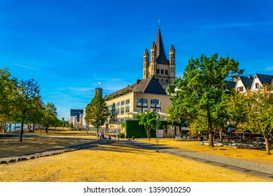 Riverside promenade and Saint Martin church in Cologne, Germany