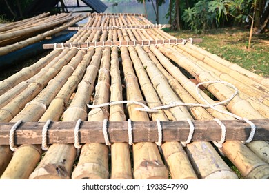 The riverside raft is made of large bamboo, dried and tied together with a tough and durable manilla rope. To be used for carrying people or things to float in the river like a boat.
