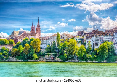 Riverside of Rhine in Basel dominated by majestic building of Munster church, Switzerland