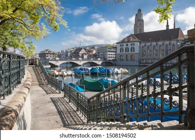 Riverside View Of Limmat River With Great Minster Church (Grossmünster), Wasserkirche And Münsterbrücke Of Zürich, Switzerland.