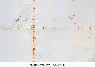 Riveted Old Weathered Rusty White Metal Background