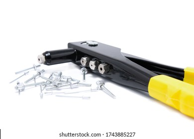 Riveting Tool With Yellow Handles And Silver Blind Rivet For Hand Riveters Isolated On White Background.