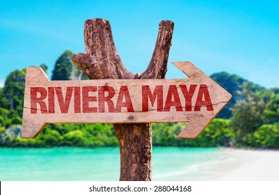 Riviera Maya Wooden Sign With Beach Background