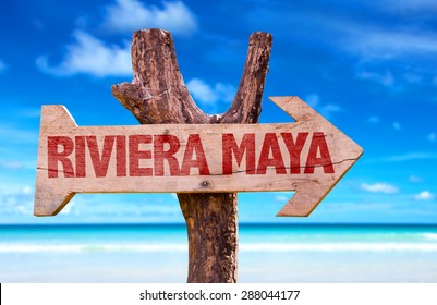 Riviera Maya Wooden Sign With Beach Background