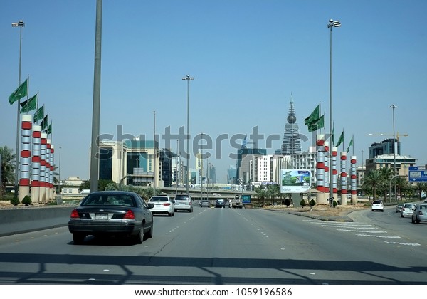 Riyadh, Kingdom of Saudi Arabia - March\
7, 2018: Cars approach the capital\'s Cairo Square Highway\
Intersections of King Fahad, Khurais and Makkah\
Roads