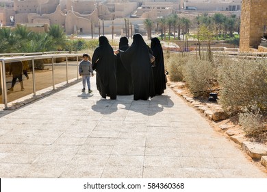 Riyadh, Saudi Arabia, January 11th, 2017: A Group Of Muslim Women And  A Boy Visiting At Historic Buildings In Dariyah Clay Castle, Also As Dereyeh And Dariyya, A Town In Riyadh, Saudi Arabia