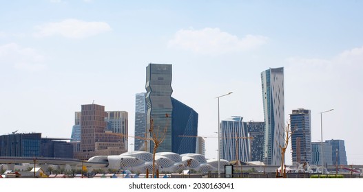Riyadh, Saudi Arabia, KSA - August 24, 2021 new buildings in the King Abdullah Financial District with train metro bridge in Riyadh