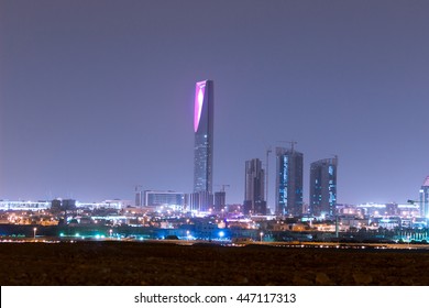 RIYADH, SAUDI ARABIA - OCTOBER 15, 2015: Outside Distance Skyline View On Riyadh Kingdom Tower And Other Skyscrapers At Night, Part Of Full Panorama