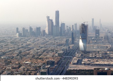 RIYADH, SAUDI ARABIA - OCTOBER 15, 2015. Zoom Skyline View At King Abdullah Financial District From The Top Of Riyadh Kingdom Tower In Foggy Cloudy Day