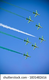 Riyadh, Saudi Arabia – September 23rd 2020:A group of professional pilots of Saudi military aircraft show tricks in the sky over Riyadh City, leaving beautiful green, white and red traces of clouds.