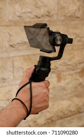 Riyadh, Saudi Arabia - September 8, 2017: An Xperia XZ Phone Is Attached To A DJI Osmo Mobile Gimbal Which Is A Device To Stabilize Video Clips Or Footages When Shooting Or Taking Selfie Photos.