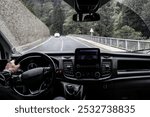 RIZE, TURKEY - 11 MAY, 2024: Male hands and travel or driving car, commute or steering wheel or en route for trip in transport. Navigation, display screen driver work journey automobile with gps map