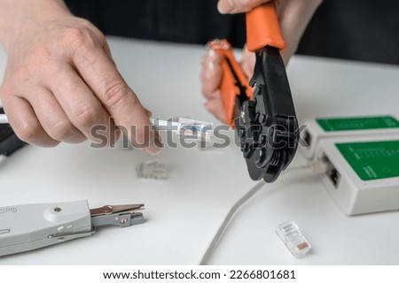 RJ45 network cable crimping with crimping tool, cable twisting tool, twisted pair Ethernet UTP Cat 6
