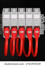 Rj45 sockets with connected patchcords with Rj45 connectors installed in the electrical switchboard. 