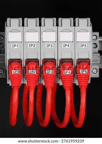 Rj45 sockets with connected patchcords with Rj45 connectors installed in the electrical switchboard. 