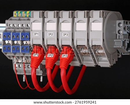 Rj45 sockets with connected patchcords with Rj45 connectors installed in the electrical switchboard. 