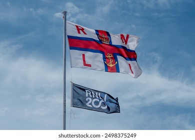RNLI flags blowing in the wind
