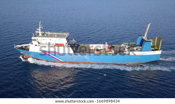 Ro Ro Ship: Aerial view of a medium RoRo\
Vehicle carrie vessel cruising at\
sea.
