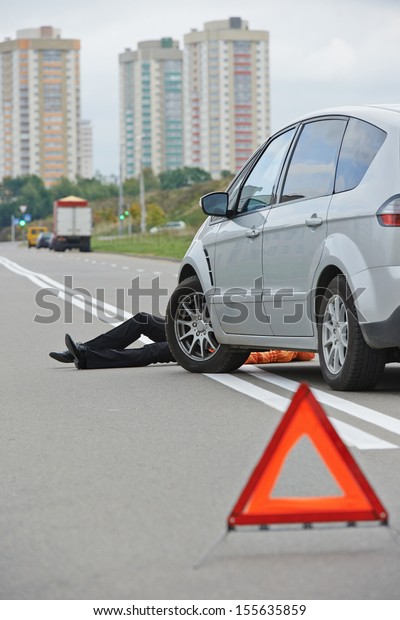 Road accident. Knock down
pedestrian and upset driver in front of automobile crash car
collision