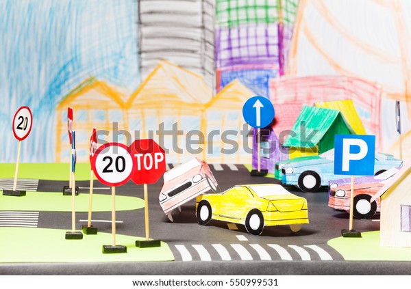Road accident
of two paper cars in the toy
city