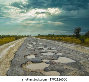 Road in Africa full with potholes, was not under maintenance or repairs for many years