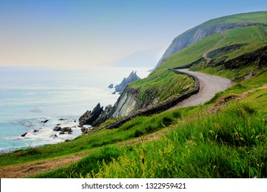 Road along the scenic coast of western Ireland. Slea Head, Dingle peninsula, County Kerry. - Shutterstock ID 1322959421