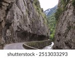 Road alongside Aude river bordered by Gorges de Saint Georges, a gorge located near the town of Axat in Aude department, southern France 