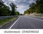 Road, asphalt highway, empty road perspective, transportation background, travel route, countryside landscape, summer day, outdoor infrastructure, scenic drive, copy space.