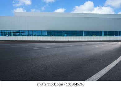 Road Asphalt Pavement And Modern Factory Warehouse

