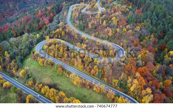 Road in autumn scenery -\
aerial shot
