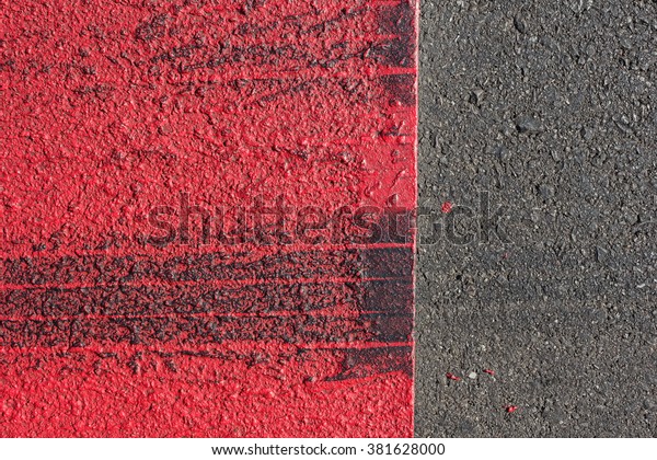 road background with crossing of red white road
marking and tire. Line On New Asphalt Road texture background.
black asphalt texture. background texture of rough asphalt. Hot
fresh asphalt