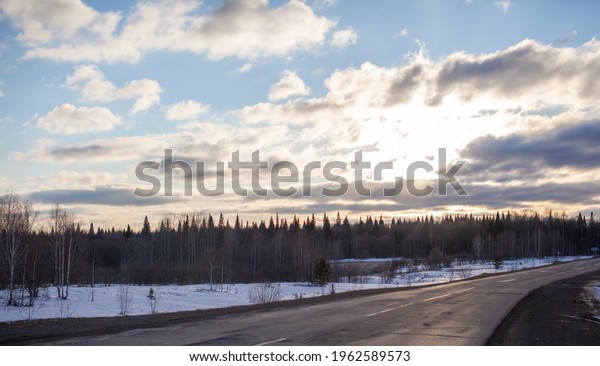 A road in the background of nature. Open road in\
the future, no cars,