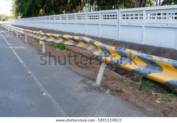 Road barrier collapsed\
in a car crash